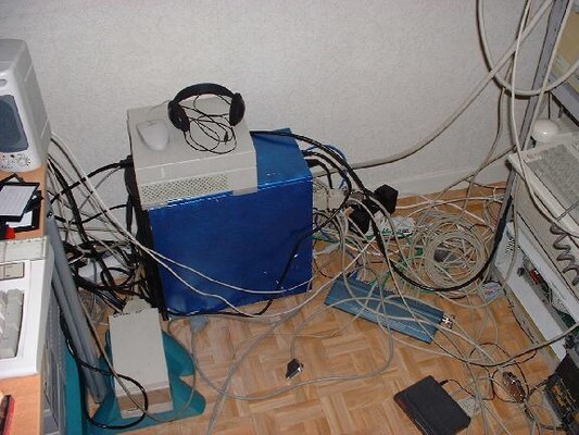 [image: a few machines lost in a maze of cables]