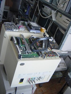 [image: a monitor with too many things on top of it]