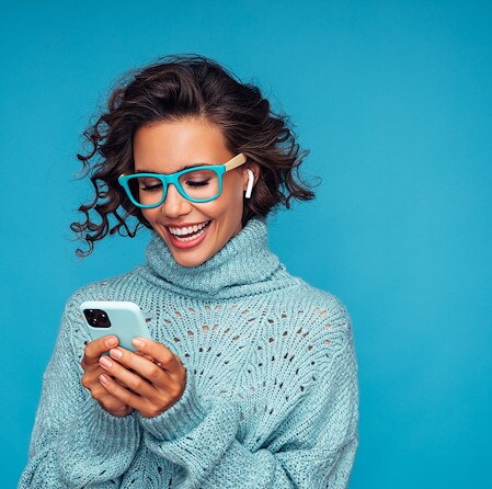 Women in blue sweater on phone