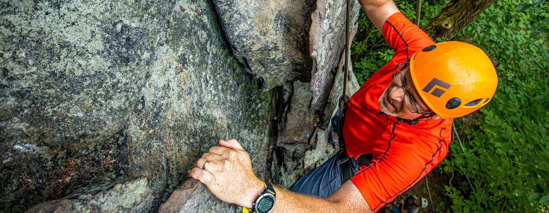 A climber grips a rocky wall Adventures on the Gorge - Lansing West Virginia USA