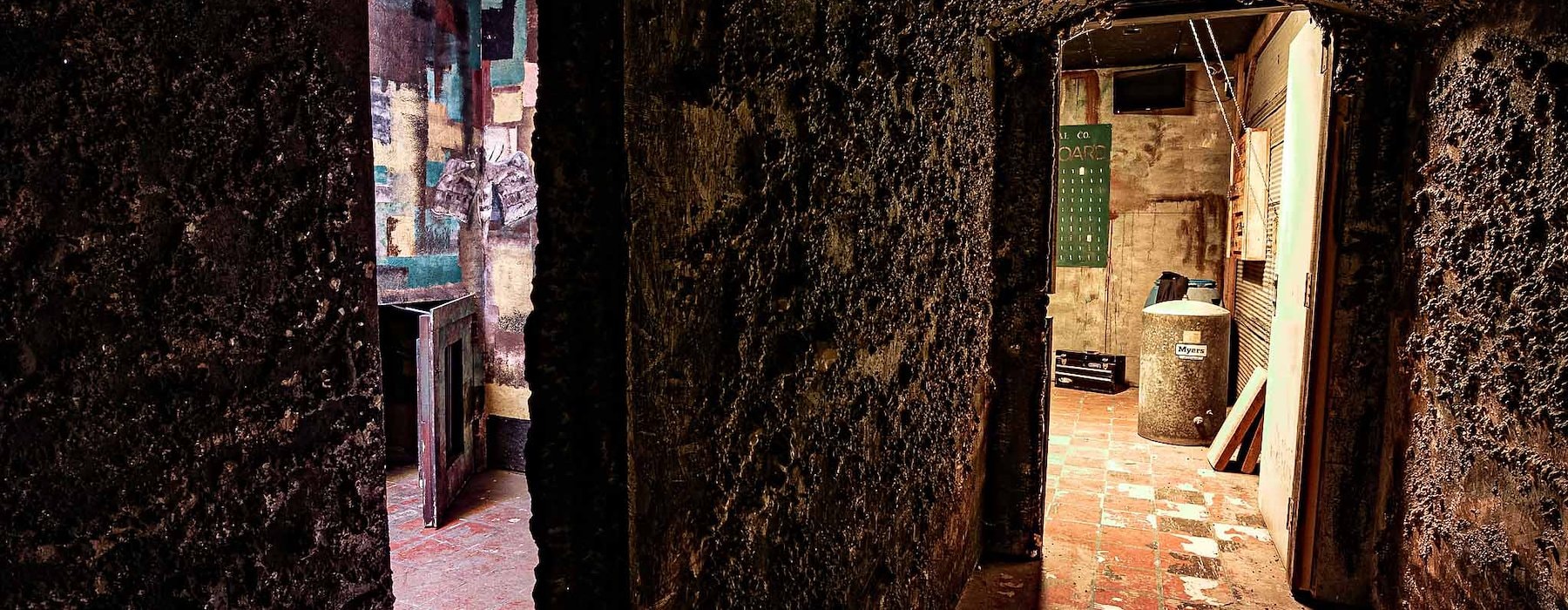 Dimly lit hallway with dark textured walls leads Adventures on the Gorge - Lansing West Virginia USA