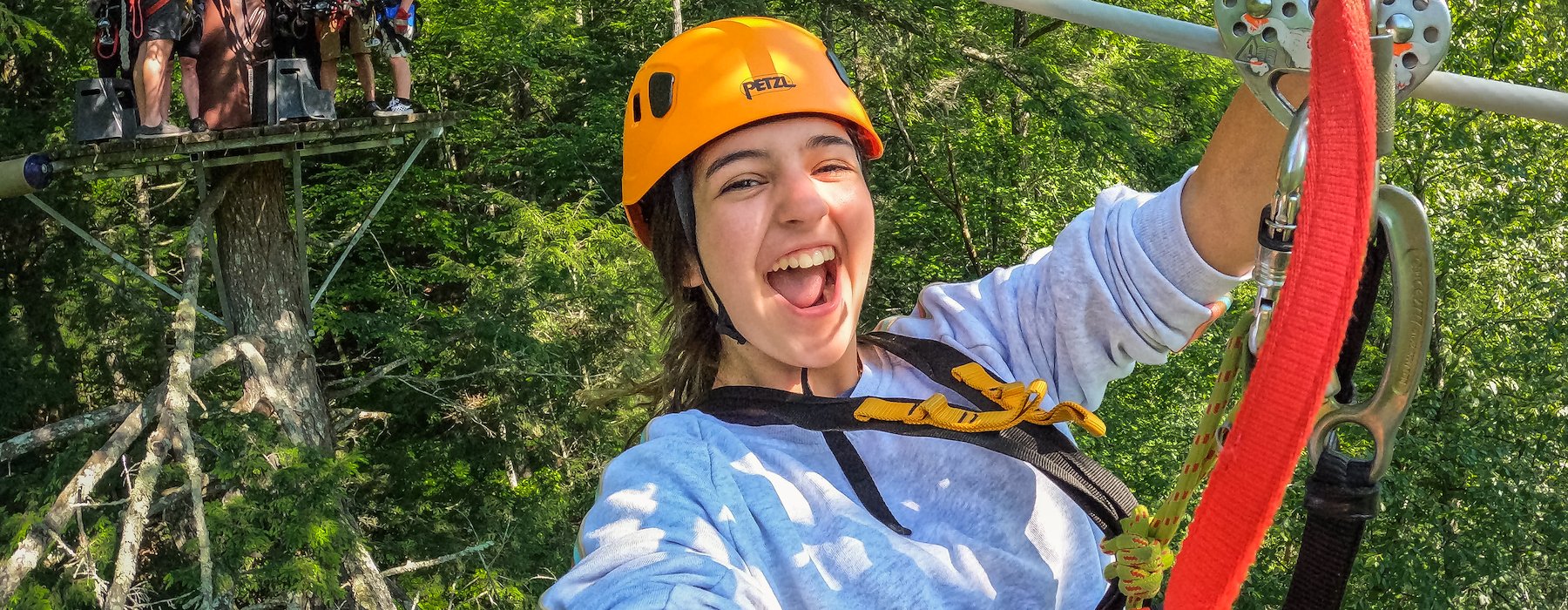 Joyfully ziplining through a lush green forest Adventures on the Gorge - Lansing West Virginia USA