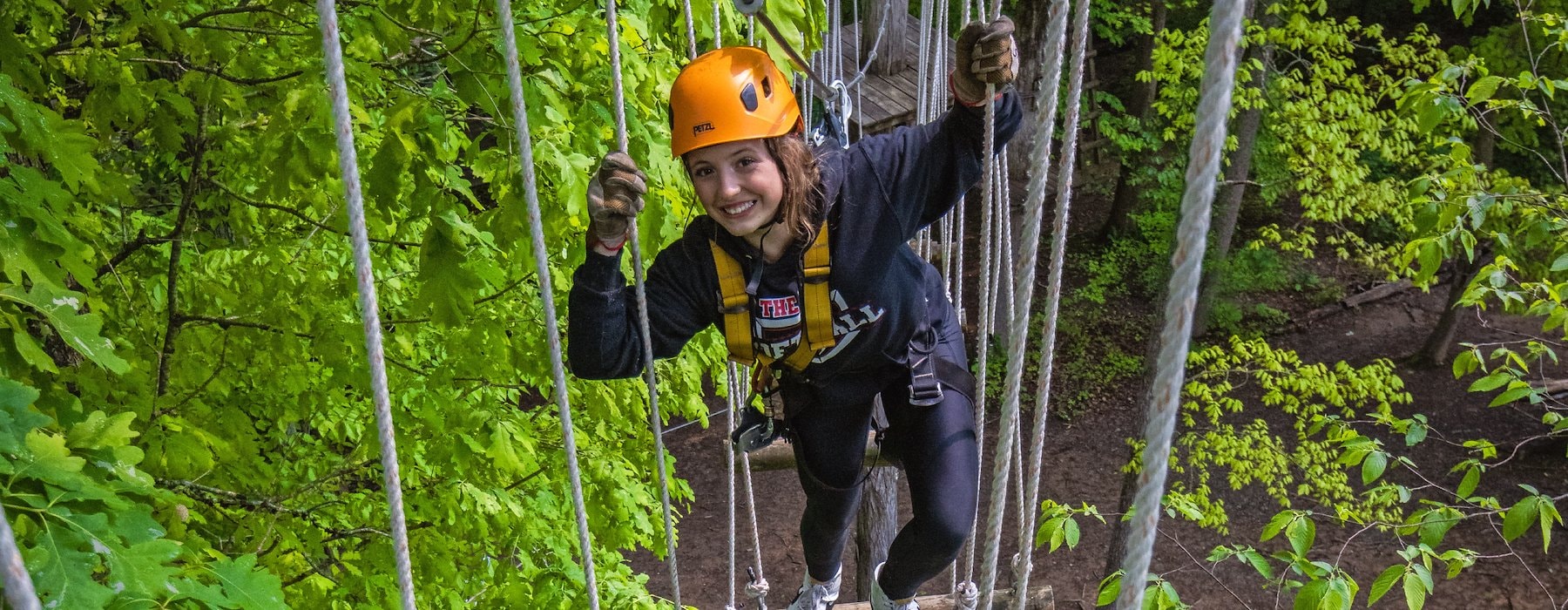 Navigates A Rope Bridge In A Wooded Area at Adventures on the Gorge - Lansing West Virginia USA