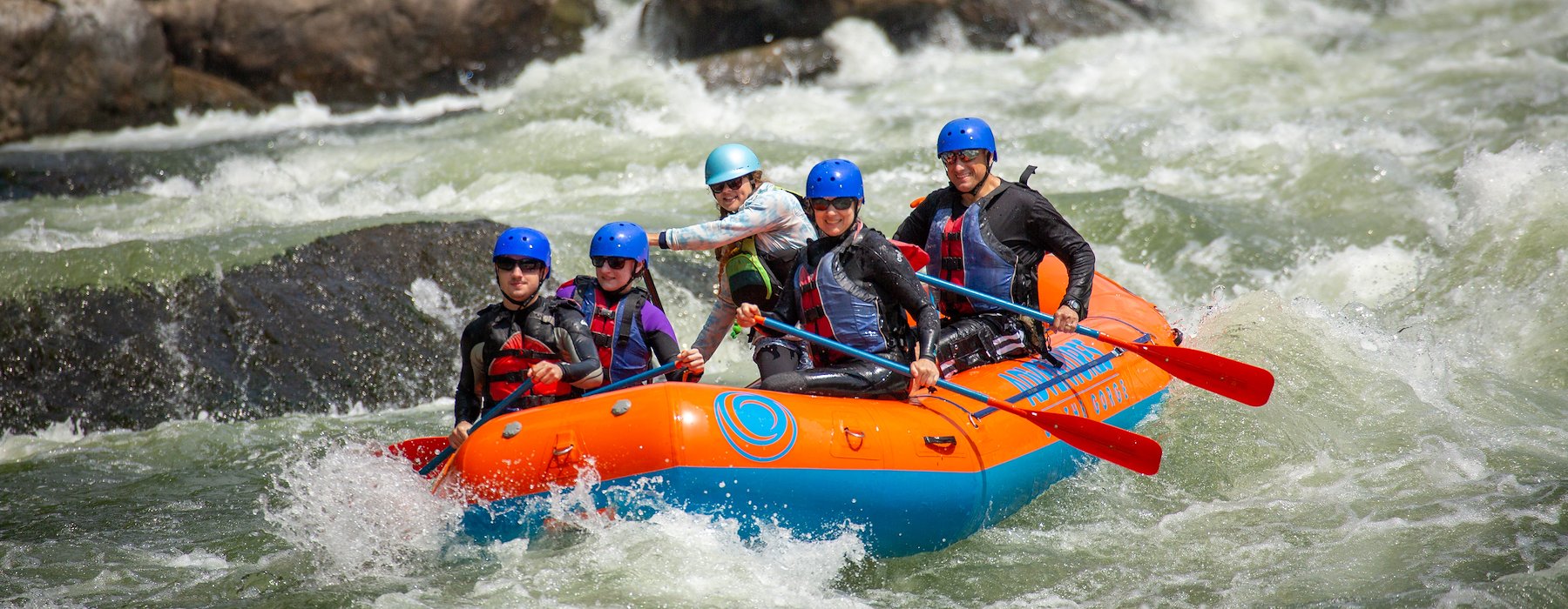 Peoples life vests raft down a turbulent river Adventures on the Gorge - Lansing West Virginia USA