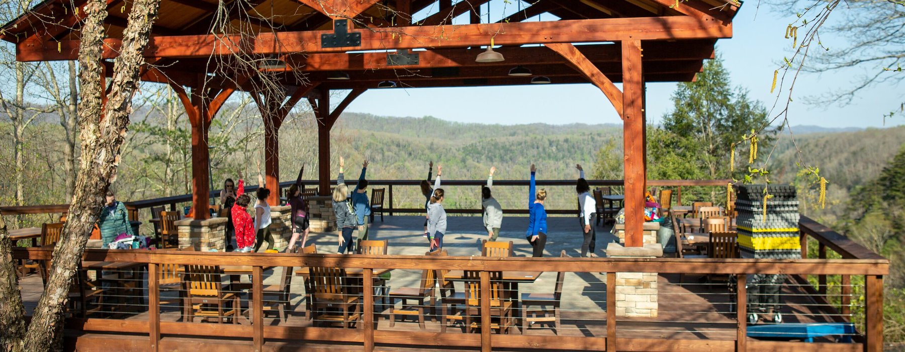 A gazebo with tables and chairs is situated on a hill Adventures on the Gorge - Lansing West Virginia USA