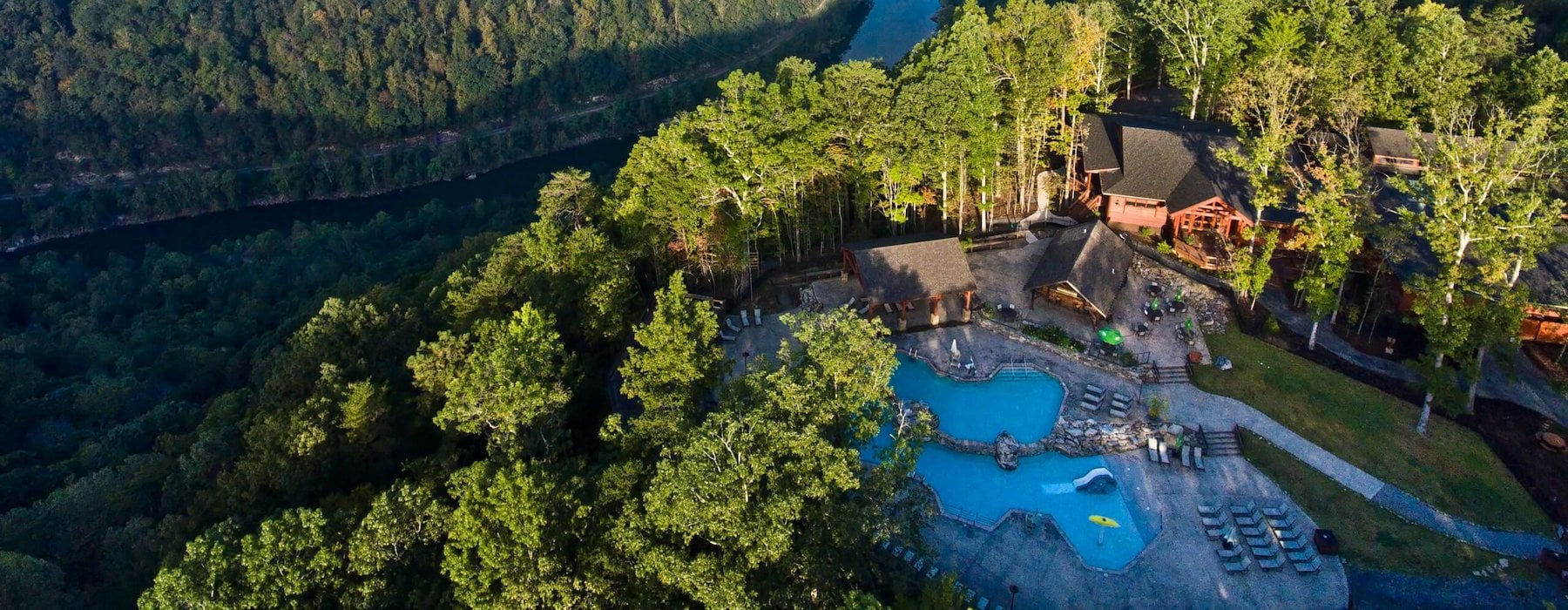 Aerial view of a resort nestled beside a winding river Adventures on the Gorge - Lansing West Virginia USA