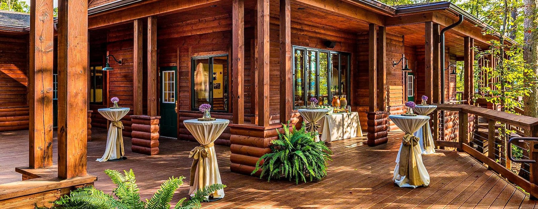 Outdoor wooden deck with multiple tables and chairs set up Adventures on the Gorge - Lansing West Virginia USA