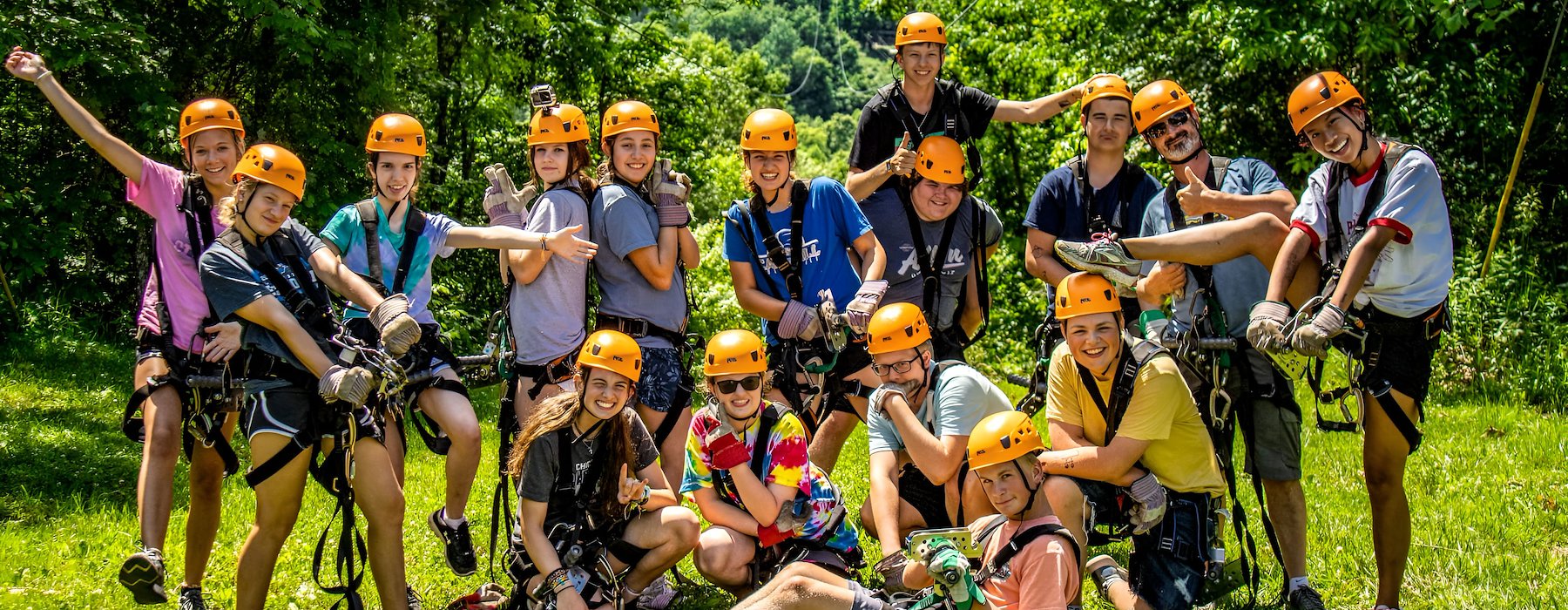 Several people equipped with helmets and safety gear Adventures on the Gorge - Lansing West Virginia USA