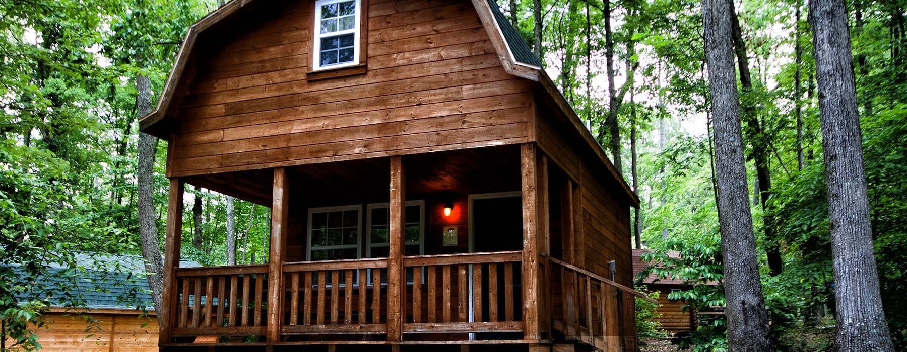 Small wooden cabin with cozy porch