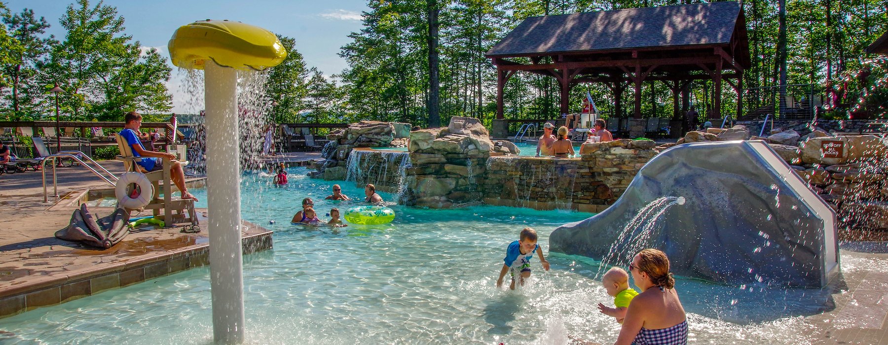 A family has fun at a resort water park playing in the water and enjoying Adventures on the Gorge - Lansing West Virginia USA