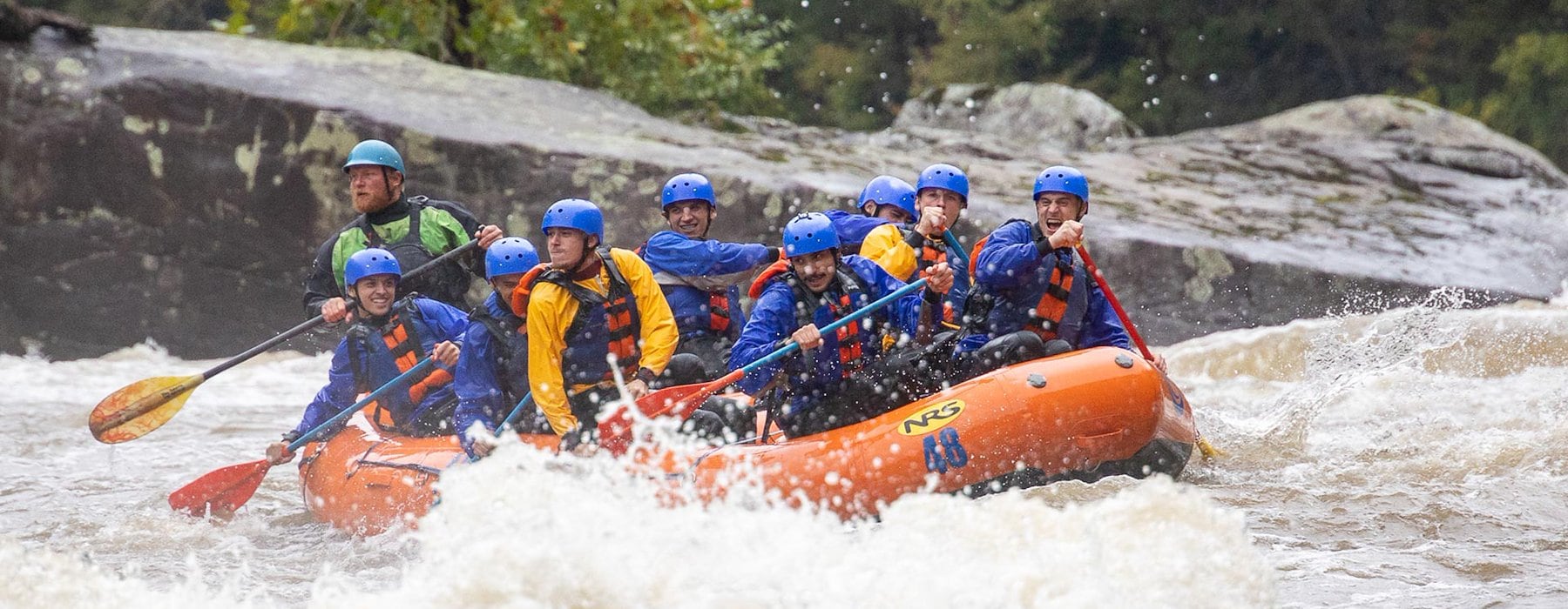 Group of peoples are white-water rafting with inflatable raft Adventures on the Gorge - Lansing West Virginia USA