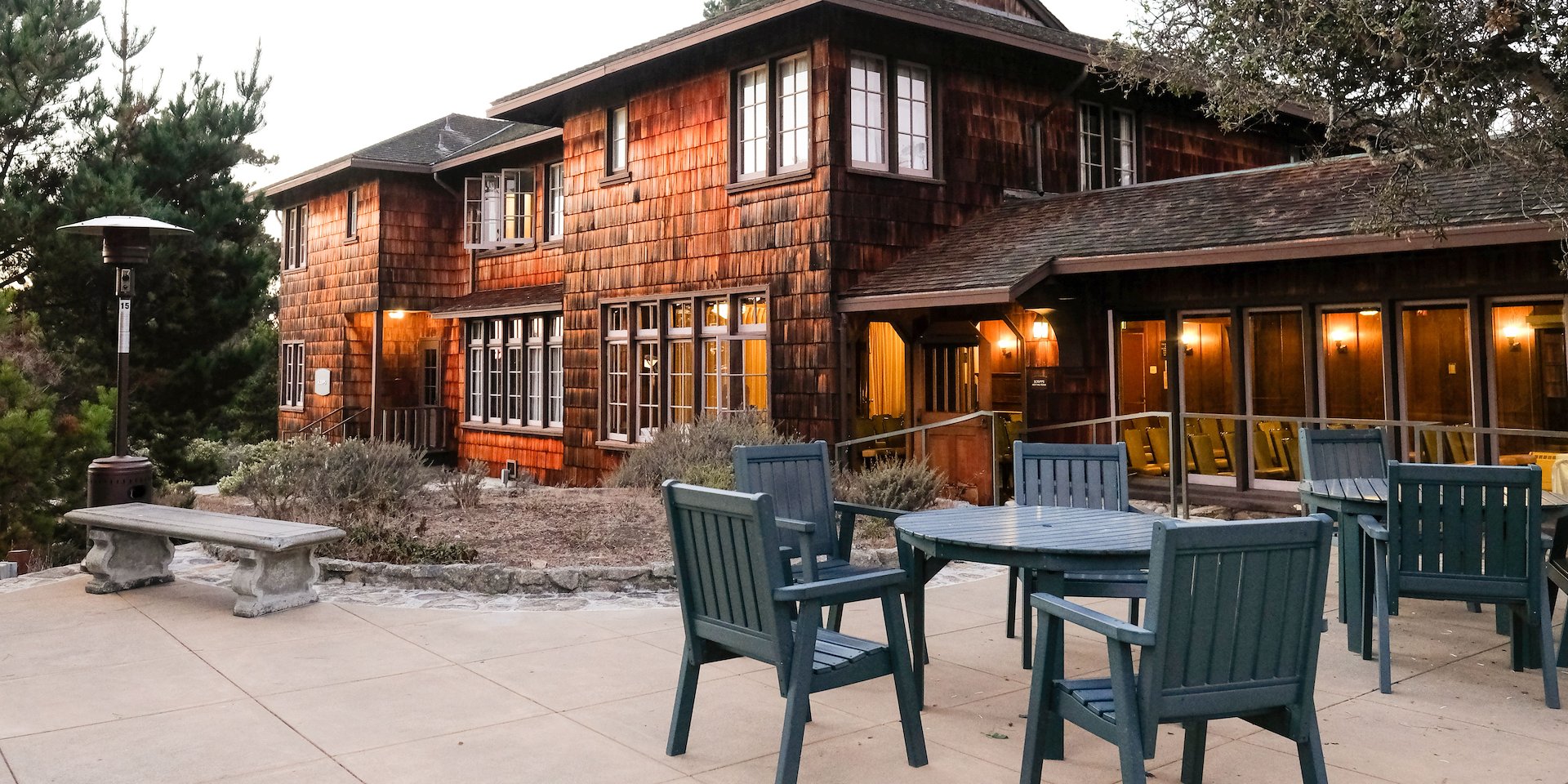 A rustic wooden lodge with glowing scenic authentic asheville Asilomar Hotel and Conference Grounds - Pacific Grove California
