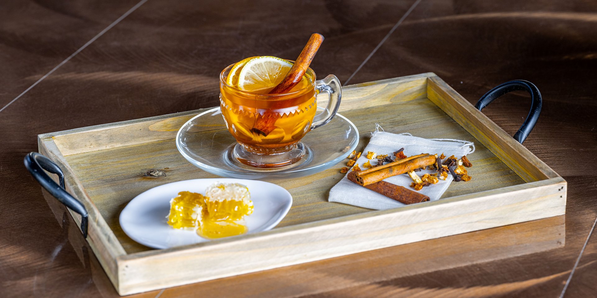 A wooden tray holds a steaming cup of tea with a lemon slice Asilomar Hotel and Conference Grounds - Pacific Grove California