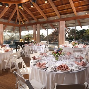 Bright banquet hall with round tables draped in white cloth Asilomar Hotel and Conference Grounds - Pacific Grove California