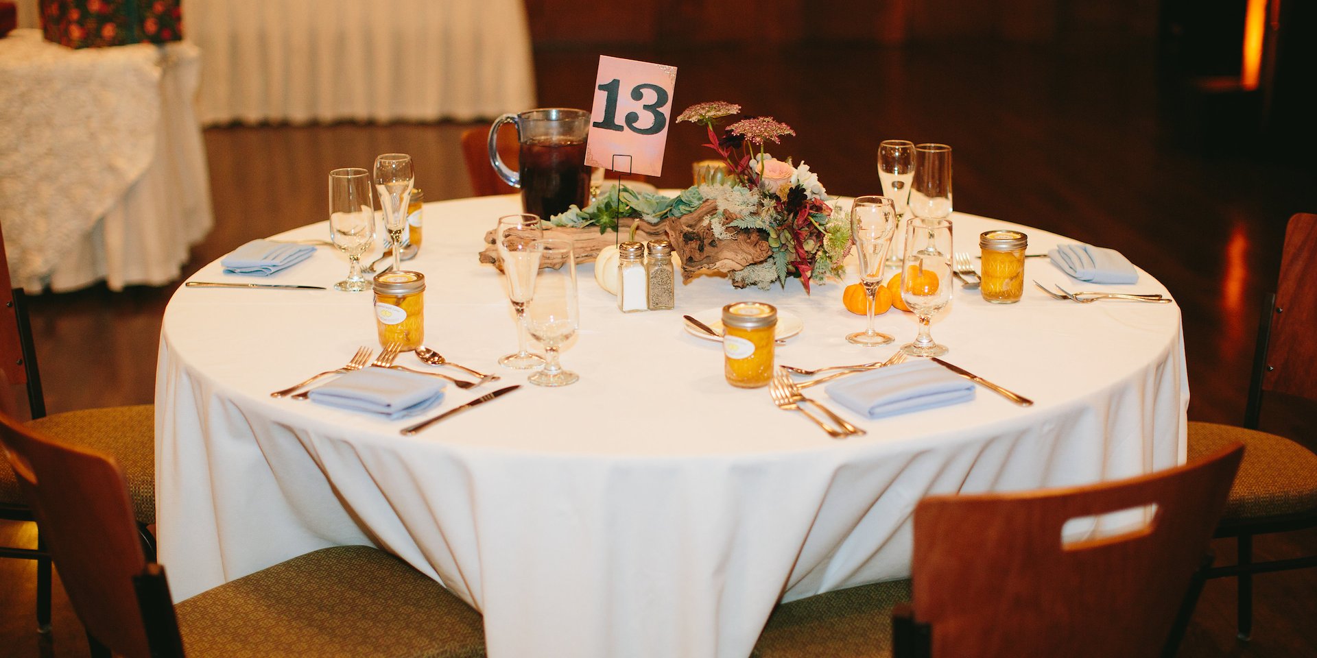 Elegant dining table set for an event with a white tablecloth Asilomar Hotel and Conference Grounds - Pacific Grove California