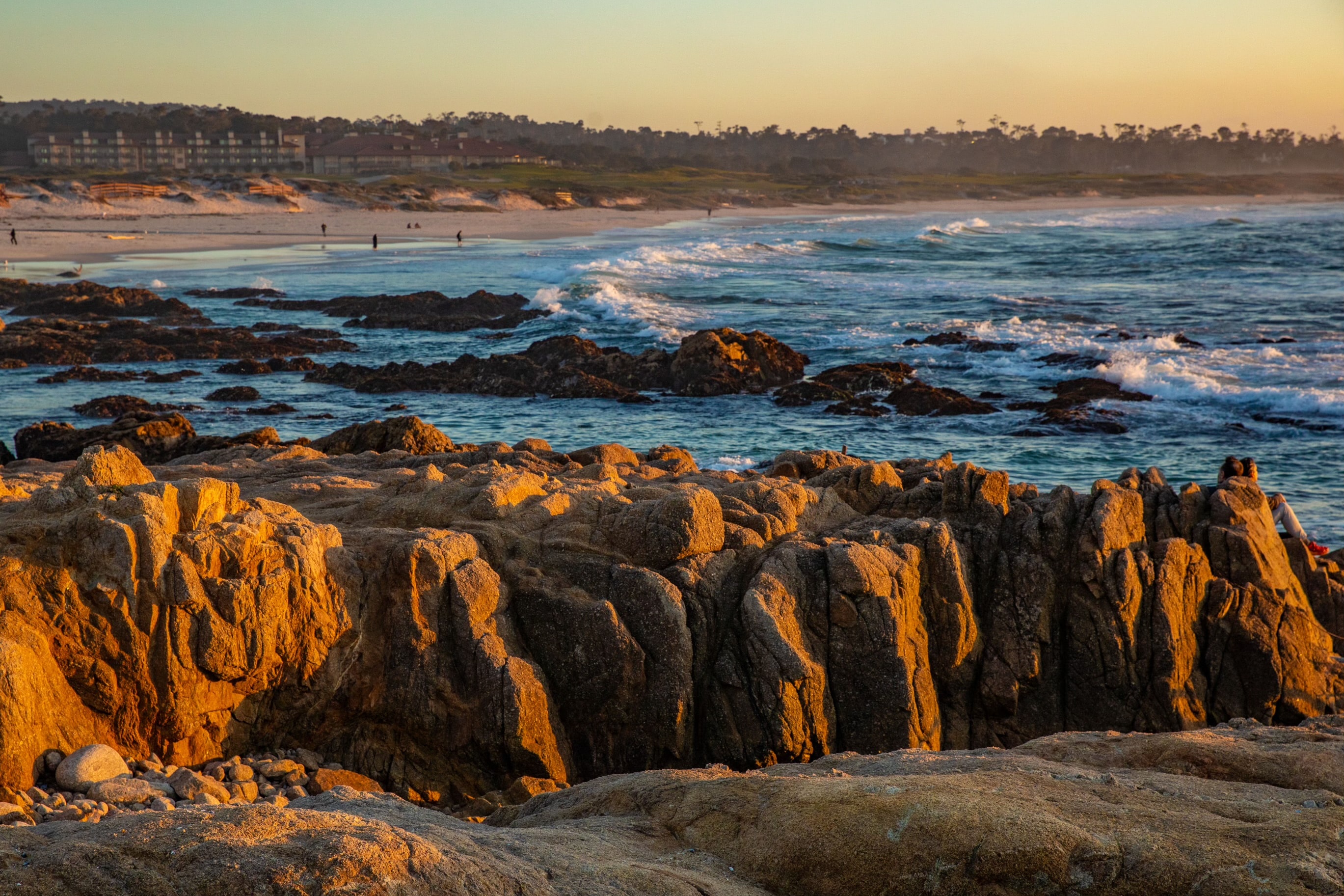 Rocky shoreline at sunset with waves crashing Asilomar Hotel and Conference Grounds - Pacific Grove California