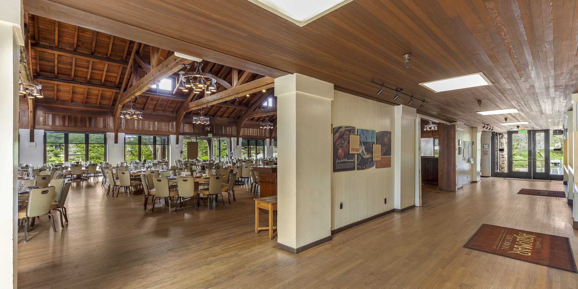 Spacious dining area with wooden ceiling and large windows overlooking greenery Asilomar Hotel and Conference Grounds - Pacific Grove California