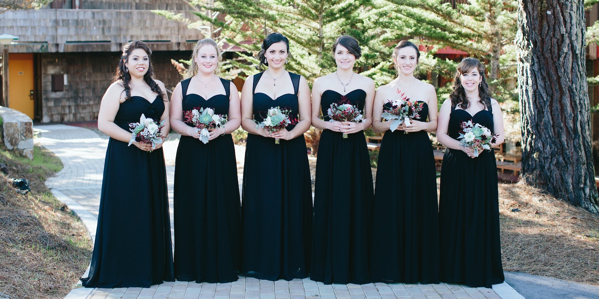 Women in black dresses stand in a line outdoors Asilomar Hotel and Conference Grounds - Pacific Grove California