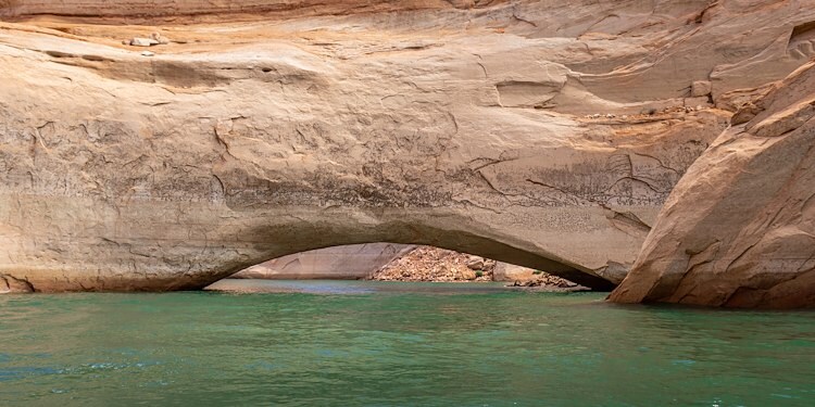 A large rock formation over water