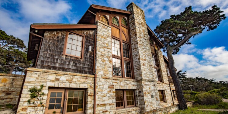 A building with a tree in the background