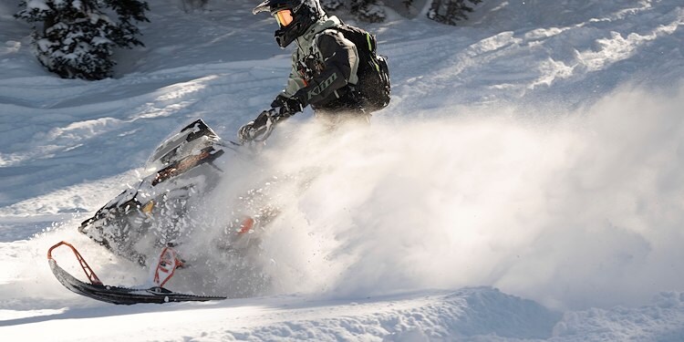 A person riding a snowmobile