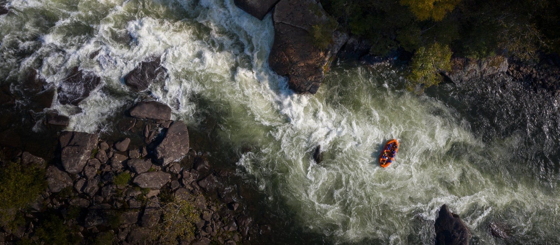 Rafting peoples paddle through rapids on a river Adventures on the Gorge - Lansing West Virginia USA