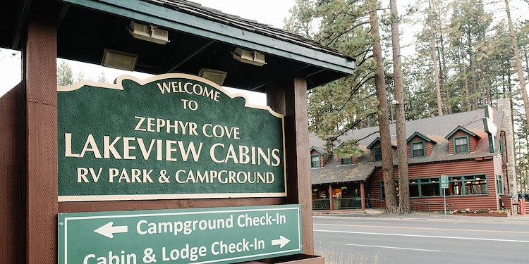 A sign on a wood structure