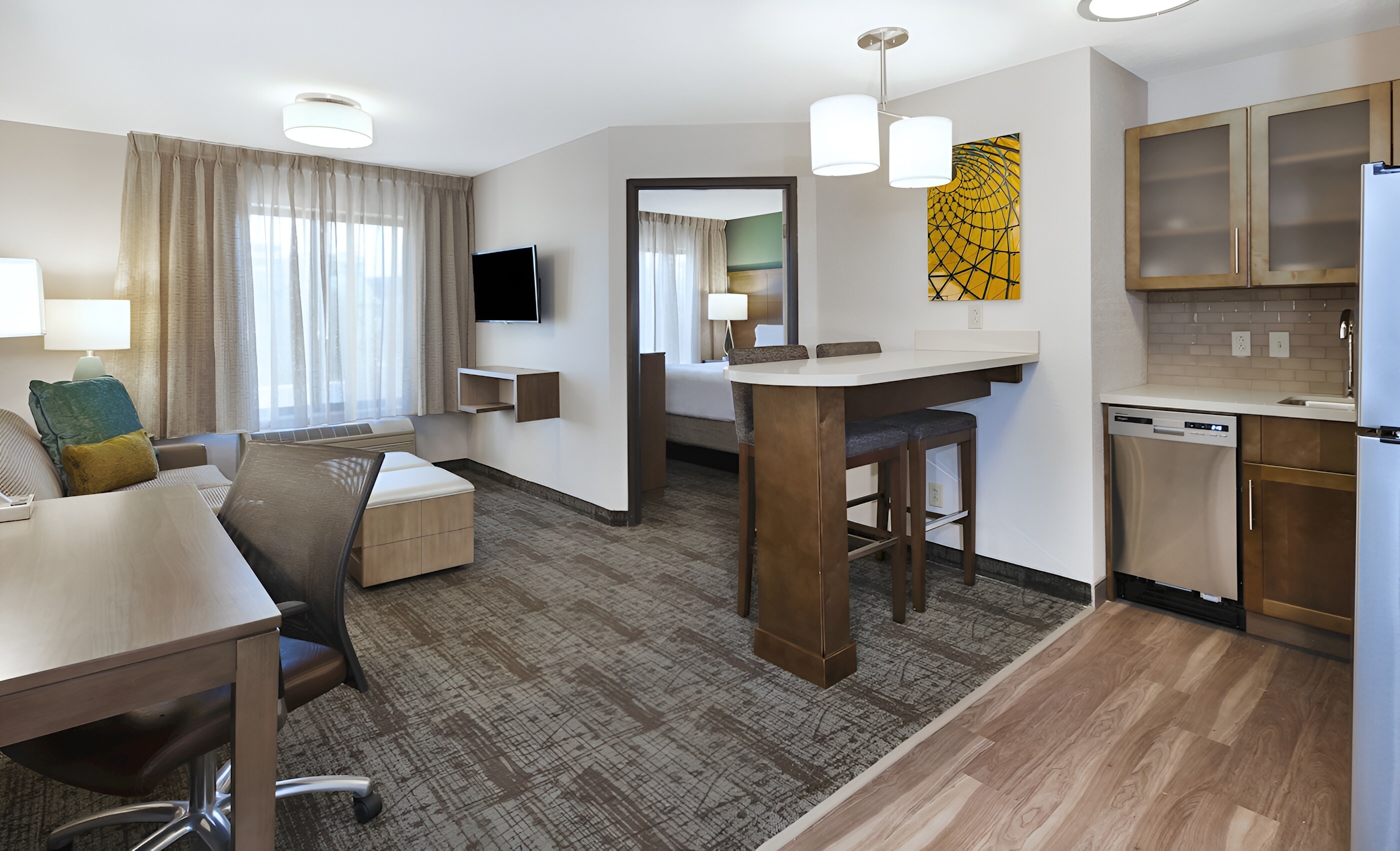 Cozy suite living area at Staybridge Suites Columbia, Missouri.