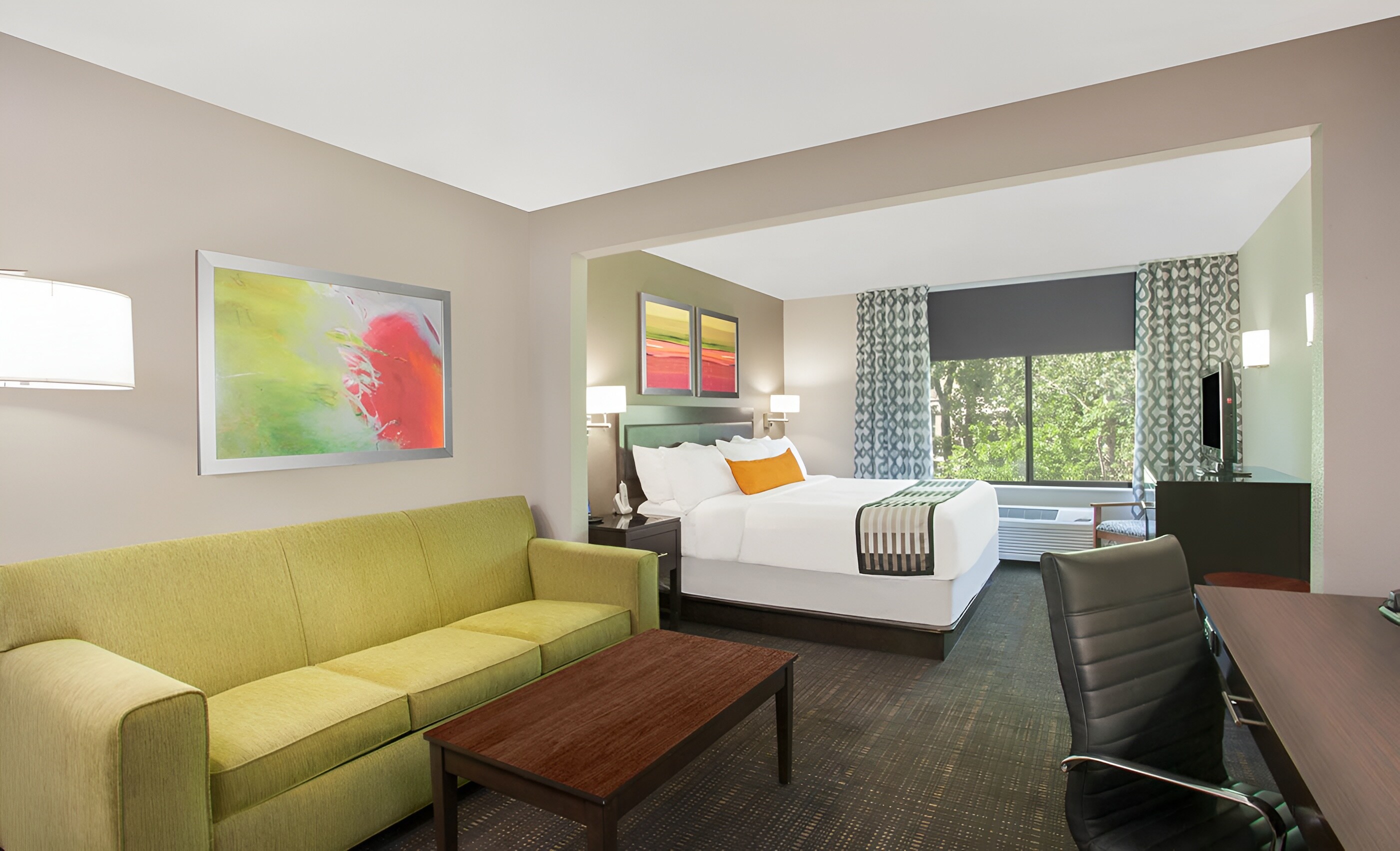 Cozy guest room at Wingate by Wyndham in Columbia, Missouri.