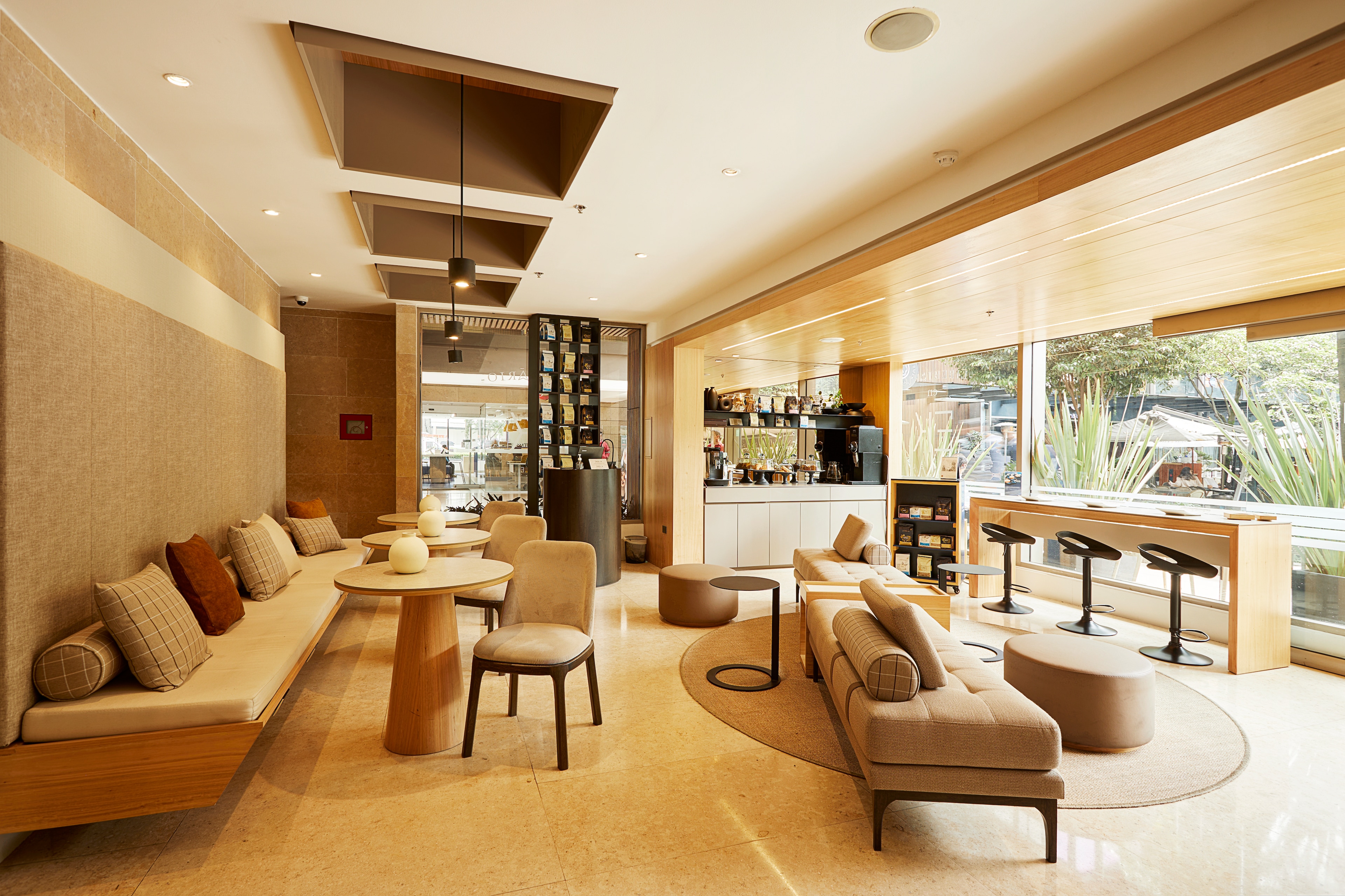 spacious room and a bar of ek hotel bogota colombia