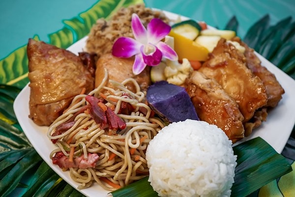 A Chief’s Luau buffet plate with rice, noodles, meats and island sides.