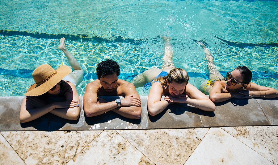 A group of people lying in a pool