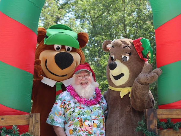Santa in hawaiian shirt with Yogi Bear and Cindy Bear
