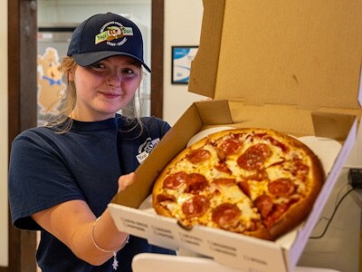 2 - 12" Pizzas (cheese & pepperoni), 2-liter bottle of soda, bag of chips, 12 cupcakes