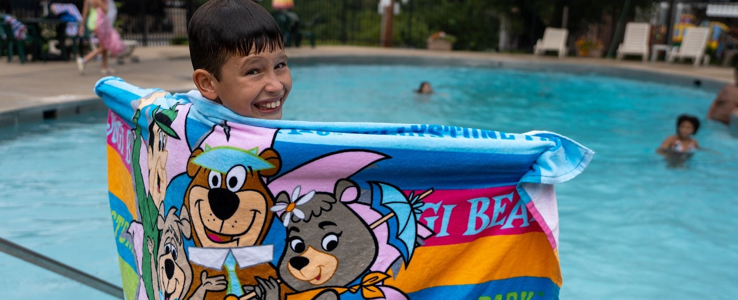 Boy at Pool at Jellystone Park™ St. Louis West