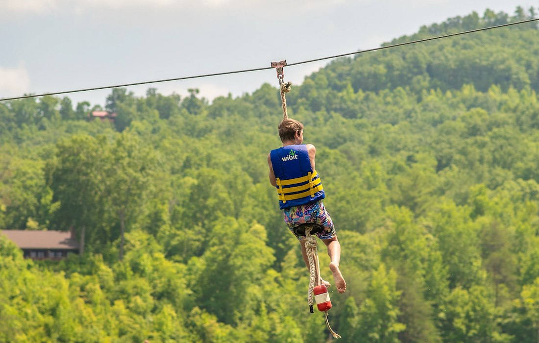 Zipline over the lake at Jellystone Park™ Golden Valley