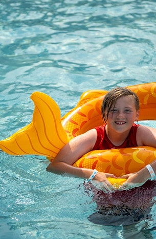 Swim, splash, and do water handstands! at Jellystone Park™ Finger Lakes