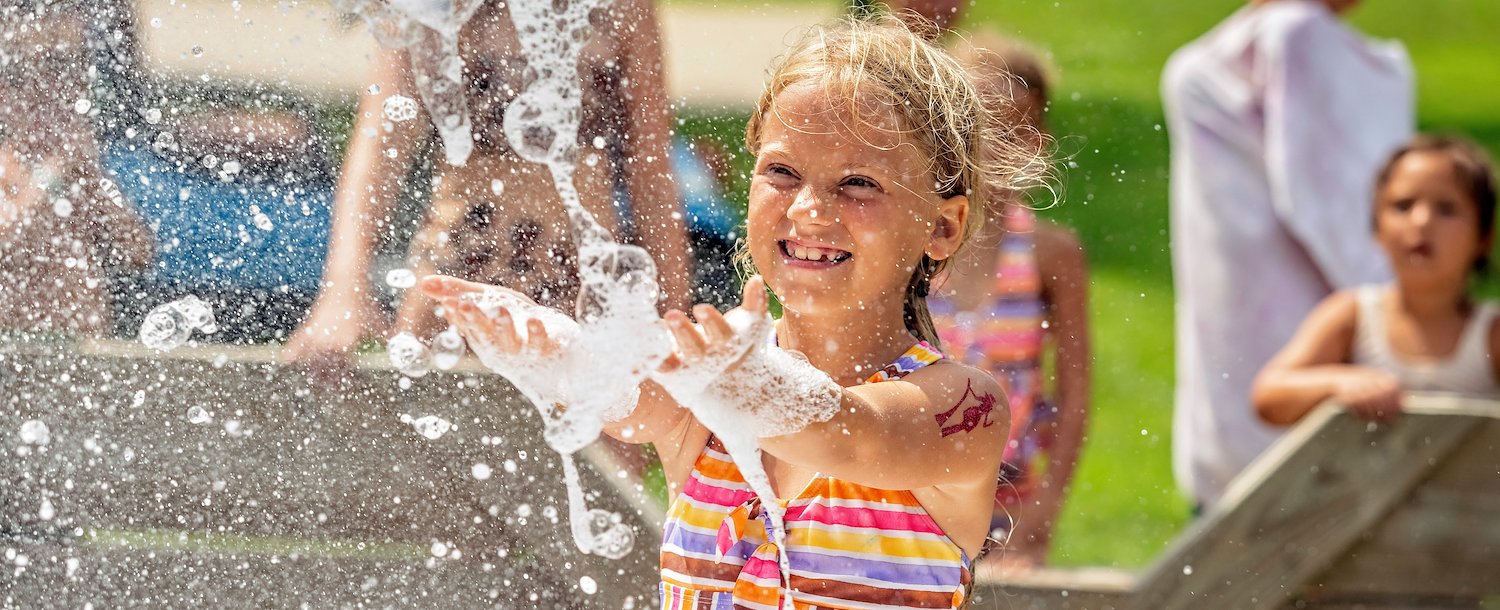 Girl Enjoying a Foam Party at Jellystone Park™ Cleveland Sandusky