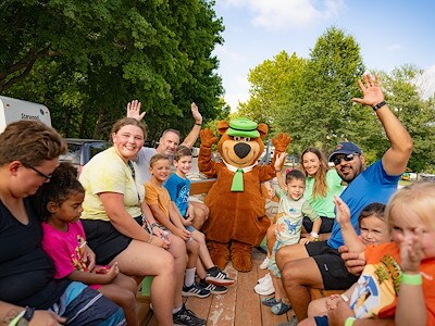 Private wagon ride around the park with a character