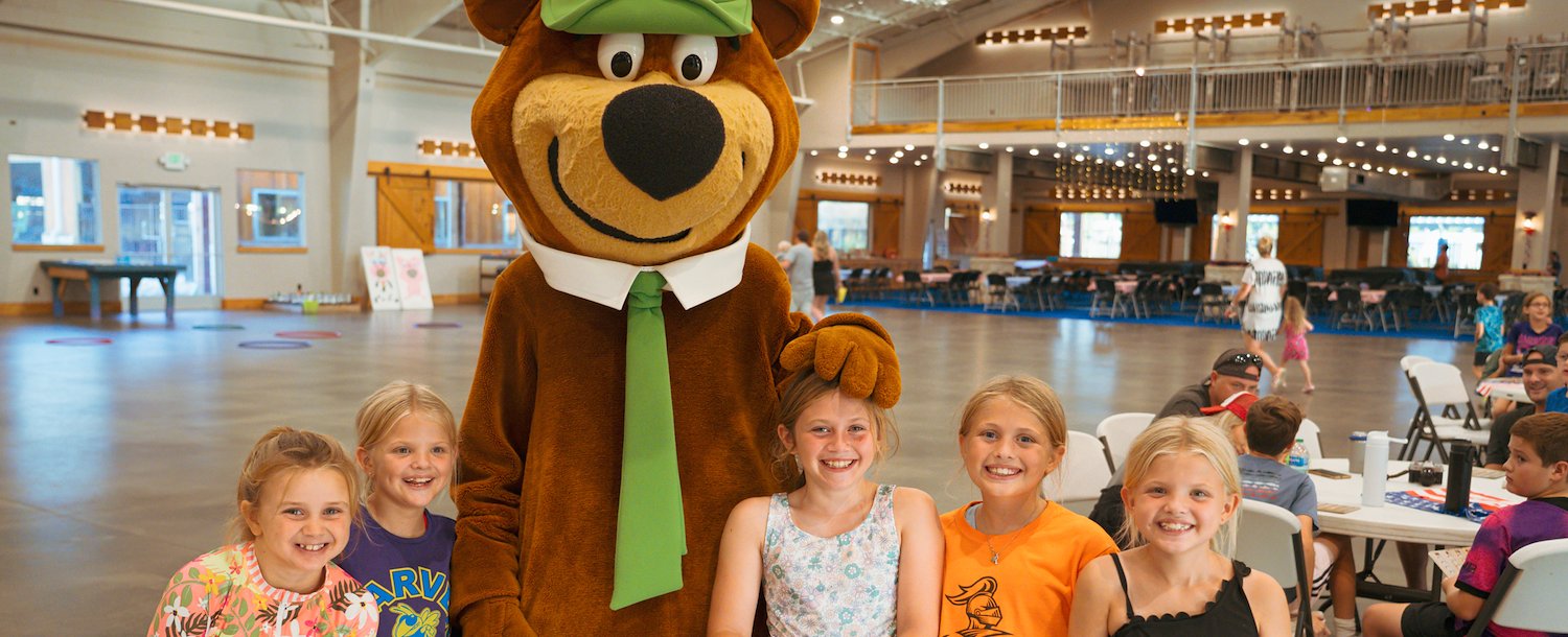 Yogi Bear™ with kids at Jellystone Park™ North Texas