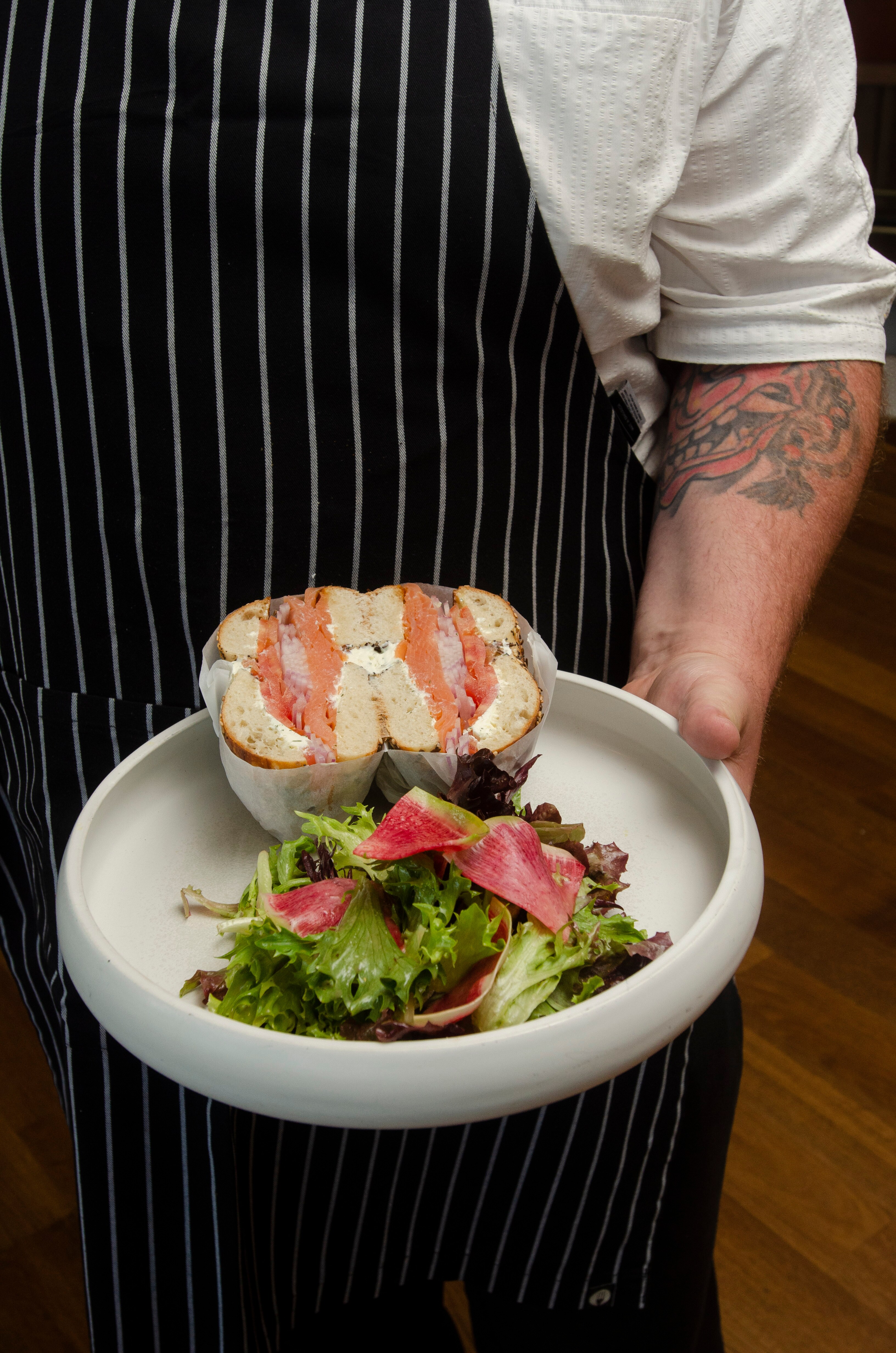 Chef-crafted burger served with salad at ROSE Town Kitchen & Bar, Boston Downtown