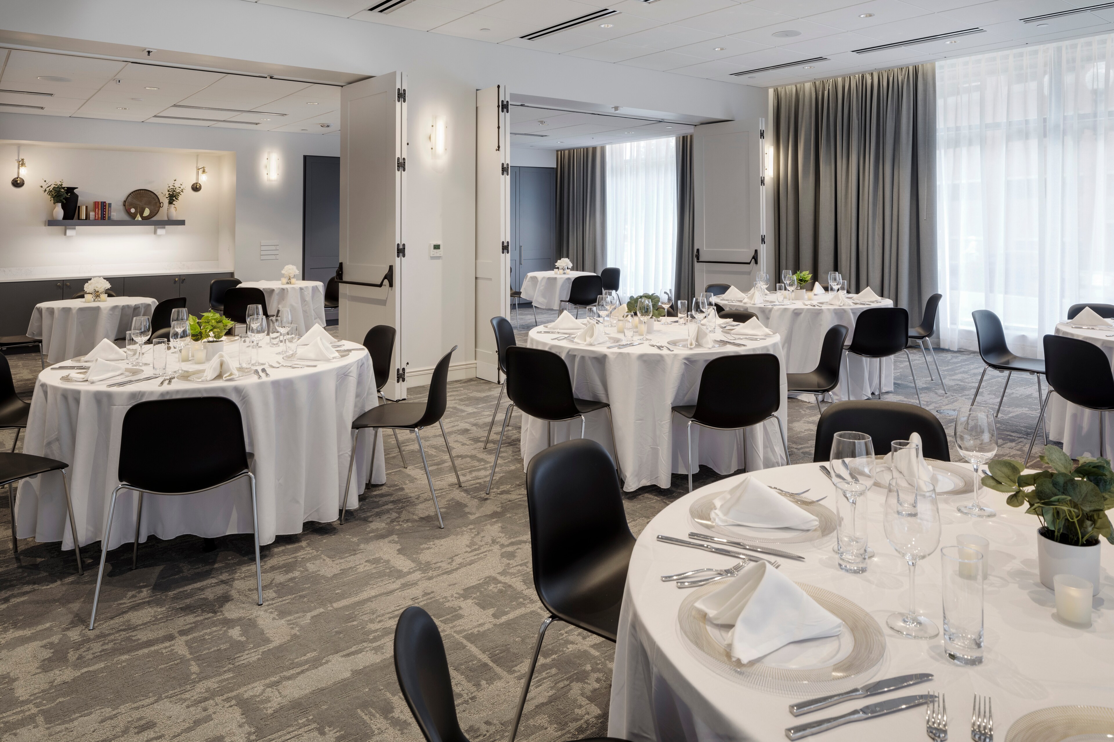 Meeting room with round table setup at Canopy by Hilton Boston Downtown