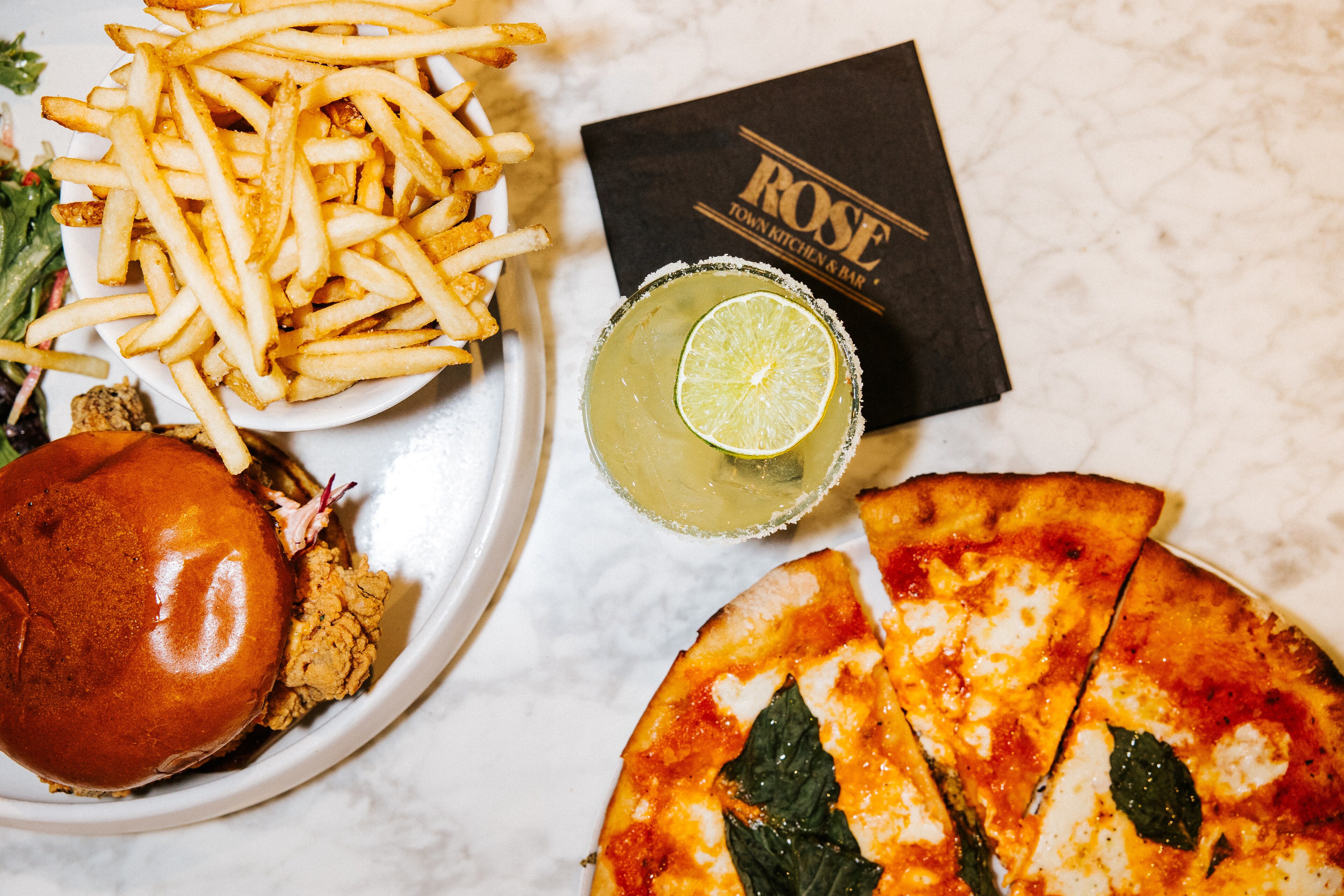 Dining at Canopy by Hilton Boston Downtown features delicious pizza and fries.