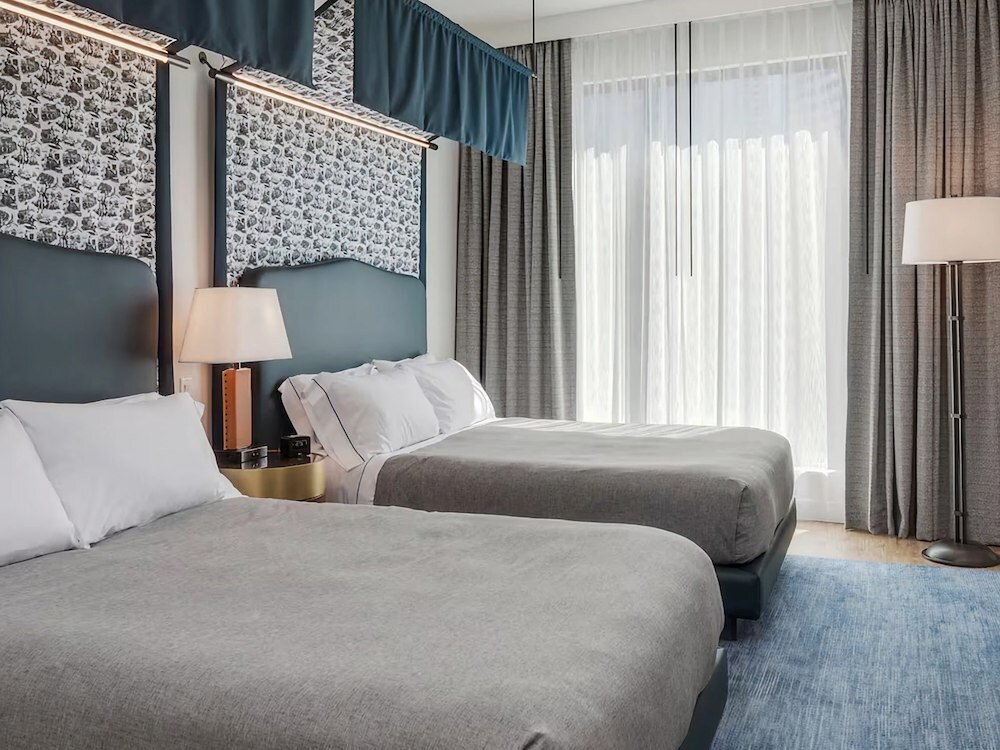 Guest room with two beds at Canopy by Hilton Boston Downtown, MA.