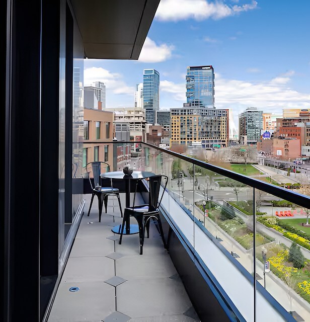 Guest room with sofa at Canopy by Hilton Boston Downtown, MA. - 4
