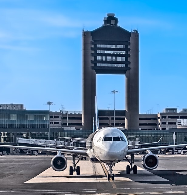 A plane parked at the airport near at Boston Downtown.