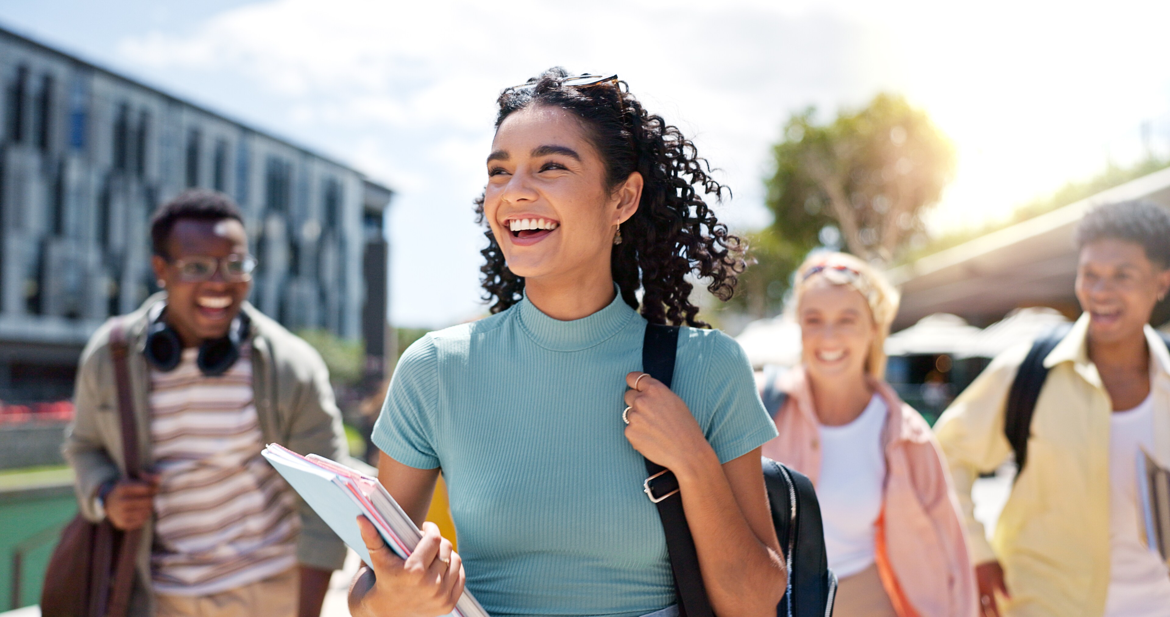 Students walking across a college campus near Boston, MA