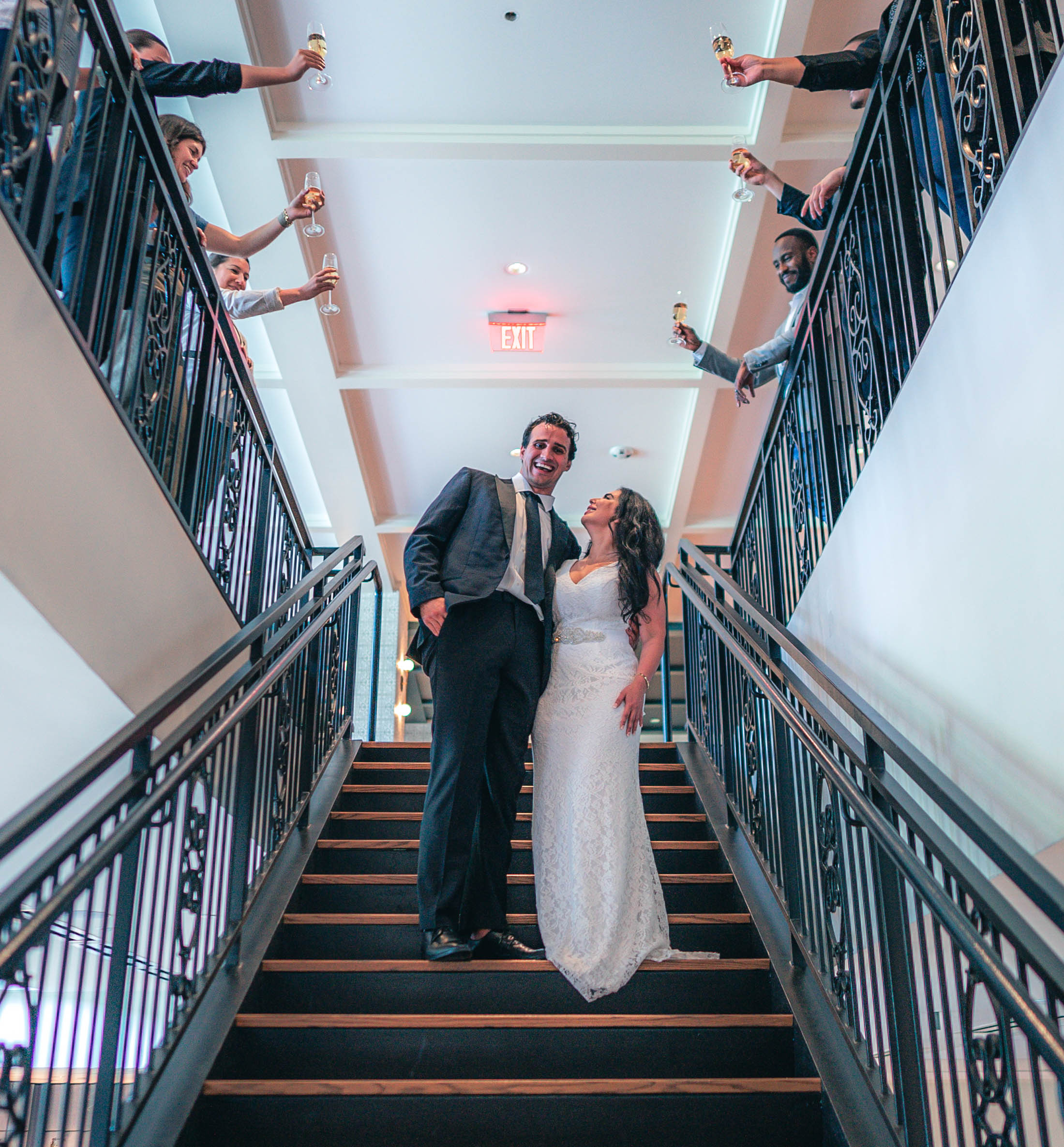 bride and groom on stairs At Canopy by Hilton Boston Downtown
