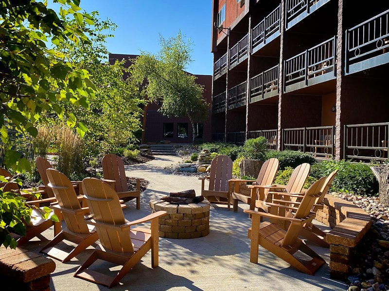 A group of chairs around a fire pit
