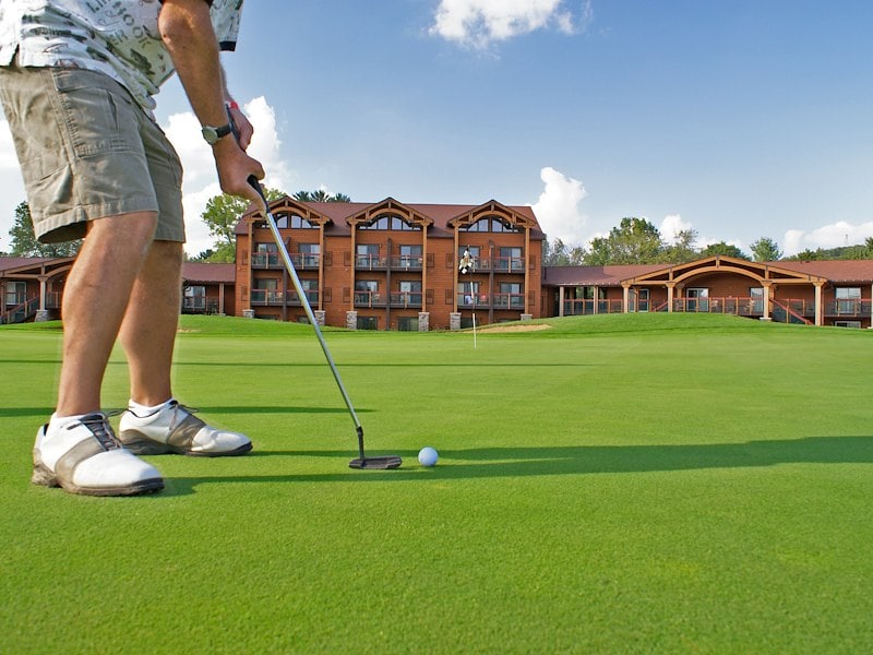 A man playing golf on a golf course